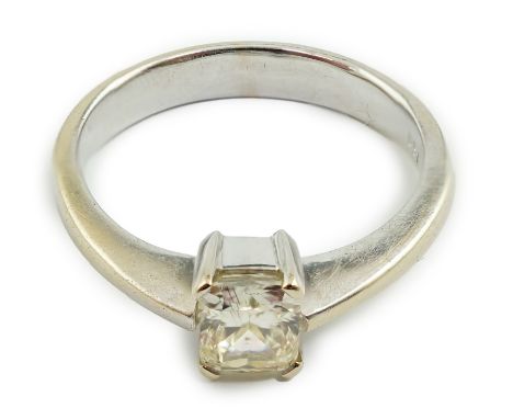 A modern 18k white gold and fancy rectangular cut pale yellow solitaire diamond set ring, the stone dimensions 5.5mm by 4.7mm