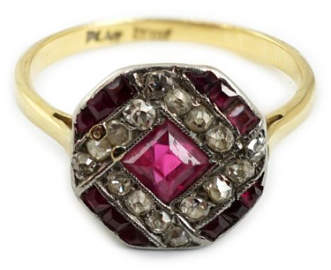 An Art Deco 18ct and platinum, ruby and diamond set octagonal cluster ring, size M, gross weight 2.2 grams.**conditionreport*