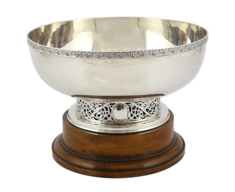 A George V Arts &amp; Crafts silver circular bowl, by W &amp; C Sissons, with Celtic revival border, on a pierced circular fo