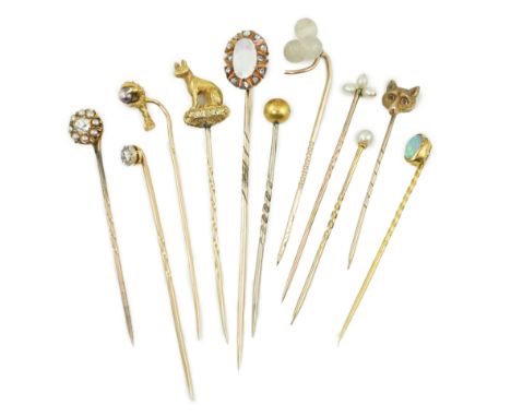 A collection of eleven assorted early 20th century and later stick pins, including gold, white opal and rose cut diamond clus