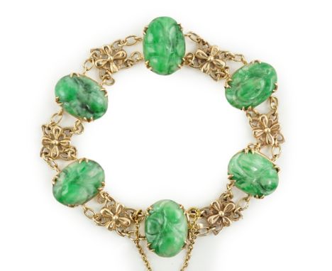 An early 20th century 9ct gold butterfly link and six stone carved jade set bracelet, each stone carved with fruit, 13cm, gro