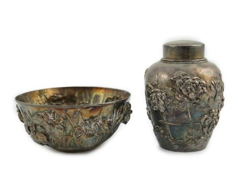 An early 20th century Japanese silver ovoid tea caddy and cover, decorated with prunus, together with a similar Japanese silv