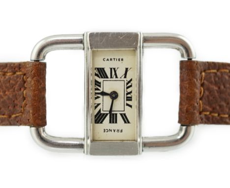 A lady's rare French 1930's stainless steel Cartier driver's manual back wind wrist watch, with rectangular Roman dial inscri