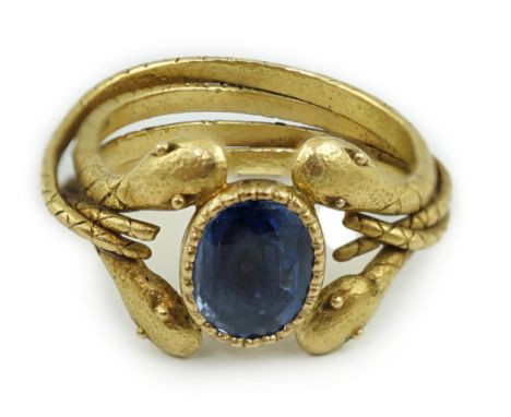 A late 19th century American Marcus &amp; Co gold and single stone oval cut Sri Lankan sapphire set serpent ring, the shank m