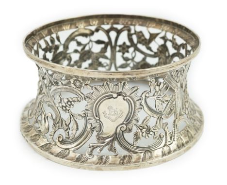 A George III Irish silver dish ring, by Matthew West, with engraved armorial and decorated with a Chinese figure, windmill an