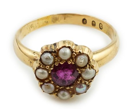 A gold, ruby and split pearl cluster ring, size O, gross weight 3.9 grams.**conditionreport**Good condition, shank stamped C 