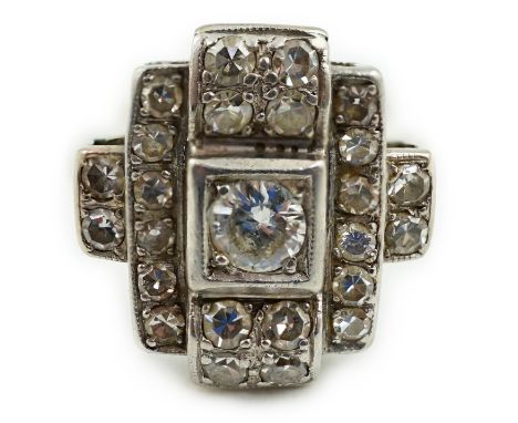 An Art Deco 18k white gold and diamond cluster set ring, of stepped design, shank cut, gross weight 5.6 grams.**conditionrepo