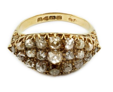 A George V 18ct gold and old mine cut diamond cluster set dress ring, with carved setting, hallmarked for Chester, 1913, size