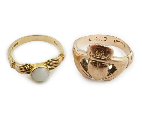 A modern 9ct gold white opal set twin hands ring, size O, gross weight 2.6 grams, and a heart and twin hands ring with rubbed