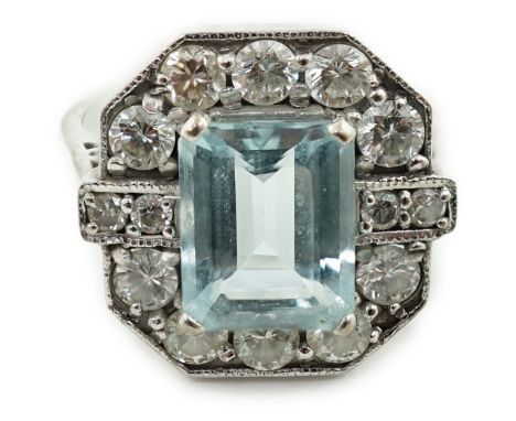 An Art Deco style white gold?, aquamarine and diamond cluster set octagonal dress ring, size N/O, gross weight 6.9 grams.**co