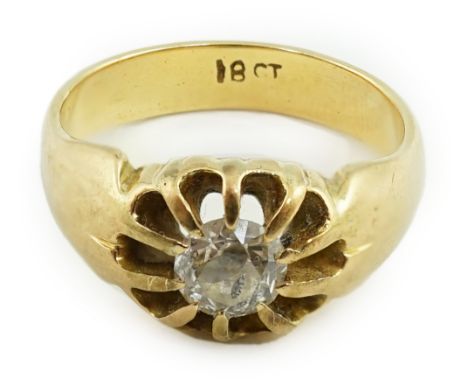 An early 20th century 18ct gold and claw set solitaire diamond ring, the stone weighing approximately 0.40ct, size K, gross w