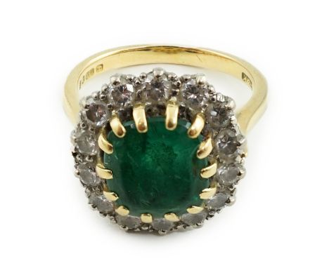 A late 1970's 18ct gold, emerald and diamond set oval cluster ring, size J/K, gross weight 6.2 grams.**conditionreport**The e