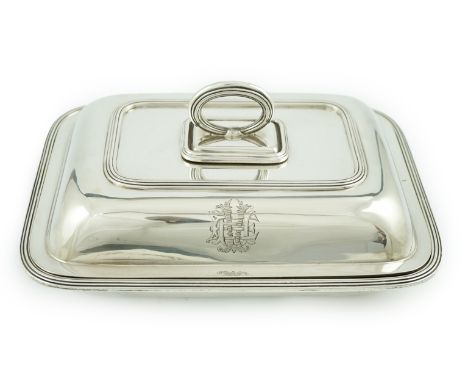 A George V silver entree dish and cover with handle, by Sebastian Garrard, of rounded rectangular form, with engraved monogra