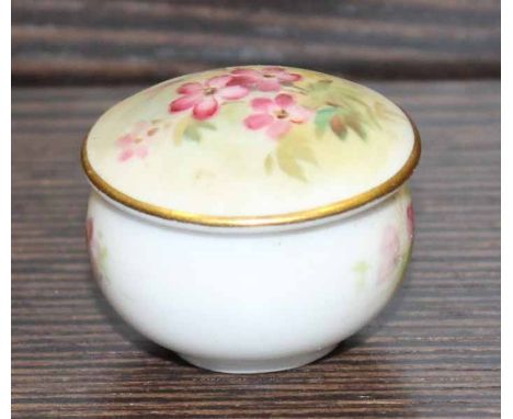 ROYAL WORCESTER HANDPAINTED PILL BOX
the lid painted with small pink flowers and signed 'W Powell', with pink factory stamp t