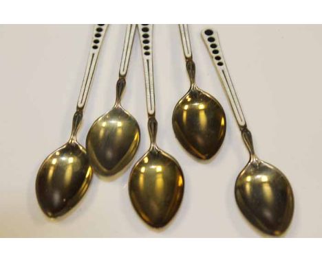 SET OF FIVE ENAMELLED SILVER TEA SPOONS
maker Walker & Hall, Chester 1938, with white enamel and stylised run of five black e