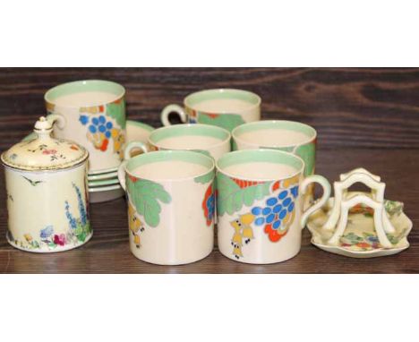 ROYAL DOULTON CAPRICE PATTERN COFFEE CUPS
six cups and four saucers, in bold stylised floral and foliate pattern, stamped in 