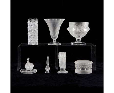 Lalique, France. Group of seven crystal glass vessels including one lidded bowl, one dish with a pair of swans, one bird figu