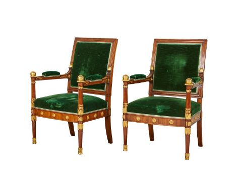 Pair of French Empire revival armchairs with gilt bronze ormolu ornamentation and rich green velvet upholstery along the back