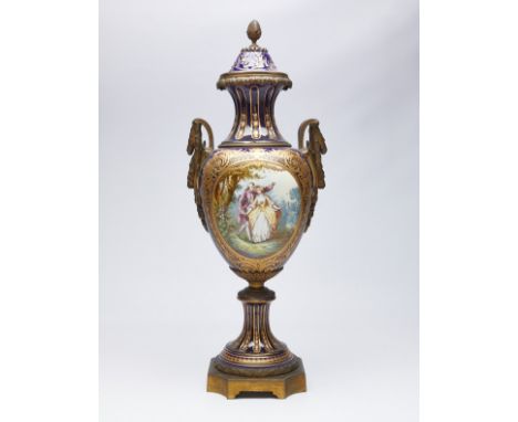 Large French old Paris Sevres style porcelain urn. One side painted with a scene of two lovers strolling through a garden; th