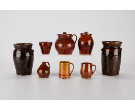 Group of eight modern redware stoneware ceramic pottery vessels. Including four lidded vessels, two with applied handles, one