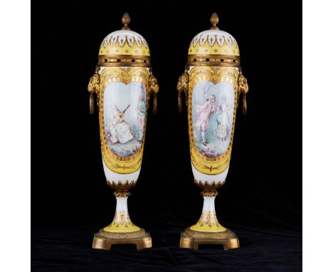 Pair of French old Paris Sevres style porcelain lidded urns. Each hand painted with scenes of two figures in the countryside 