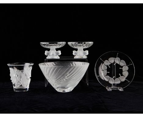 Lalique, France. Group of five crystal glass vessels including one bowl, one cup decorated with grapes and grape leaves, one 