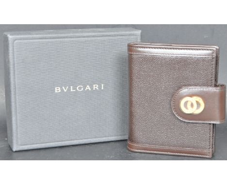 A contemporary designer Bulgari / Bvlgari leather notepad having had iconic gilt double ring to the strap opening to reveal b