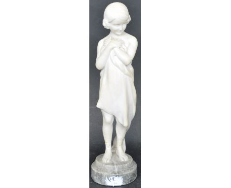 An 20th century carved alabaster figurine of a young girl by Goldscheider raised on a circular stone base. Foundry mark to th