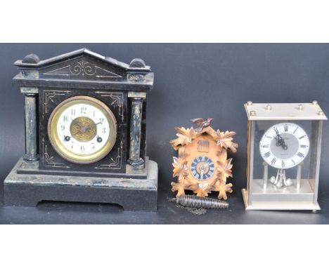 A collection of three early 20th century and later clock comprising of a faux slate mantel clock of architectural form, a 20t