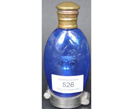 An early 20th Century moulded blue glass and nickel plated apothecary medical chemists Dettweilers sputum flask or portable s