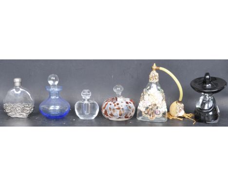 A collection of vintage retro 20th century perfume bottles. The collection comprising of glass bulbous form with stoppers alo