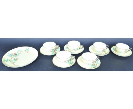An early 20th century circa 1930s Art Deco Royal Worcester china tea service having a yellow background with raised polychrom