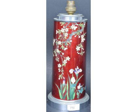 A vintage mid 20th century Chinese Oriental Cloisonne table lamp having a red background with polychrome floral decoration ra
