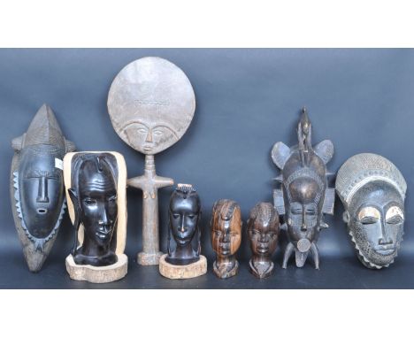 A collection of 20th century African tribal art work / figurines. The collection includes ebonized wooden African bust and ce