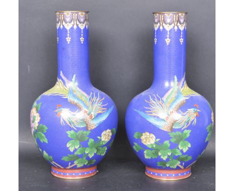 A pair of 20th century Chinese oriental&nbsp;Cloisonné enamel vases. The vases of a large bulbous form being decorated with b