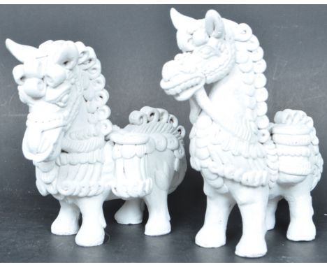 A pair of vintage 20th century hand crafted horse figures in the manner of Chinese Foo dogs modelled in red clay and overpain