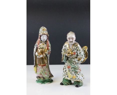 Pair of Oriental ceramic figures with hand painted and gilt decoration