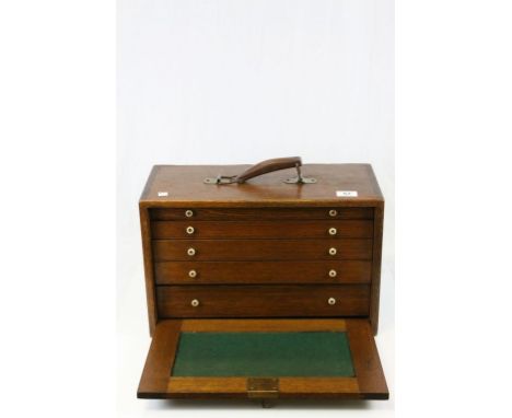 A vintage oak portable five drawer tool cabinet