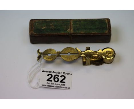 Cased set of sovereign and half sovereign scales, makers Smith, Crown engraved to finial, length approximately 9.5cm 