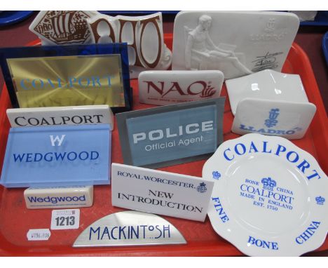 Ceramic Advertising Shop Display Signs, three Nao, two Lladro, etc. Mackintosh, Police and others in plastic (13):- One Tray.