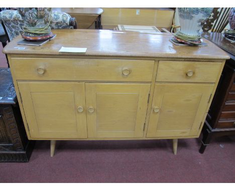 Ercol Sideboard, with well to back, two drawers over three cupboard doors, on splayed legs,(no label), 123.5cm wide.