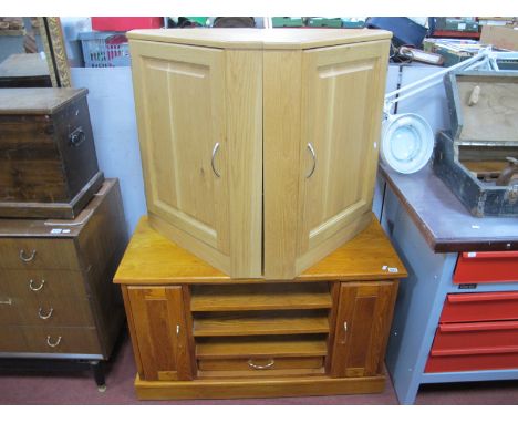 An Oak Side Cabinet, with pull out compartments flanking open shelves, 102cm wide, a pair of light oak corner cupboards, with