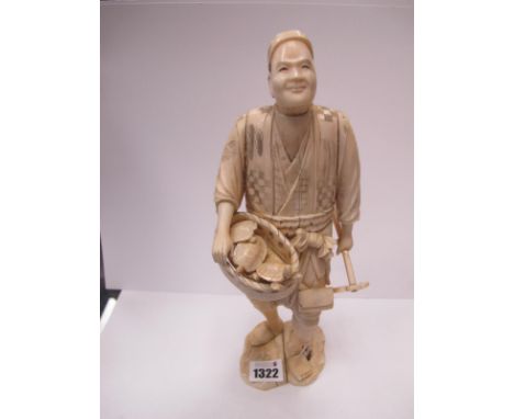 A Japanese Late XIX Century Sectional Ivory Figure of a Gentleman, holding a fork and a basket containing turtles, 28cm high.