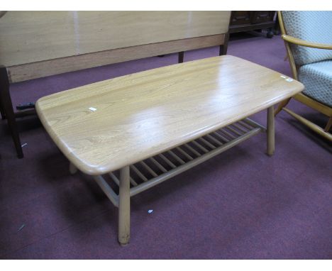 Ercol Coffee Table, with rounded corners to rectangular top over rail under shelf, 105cm wide.