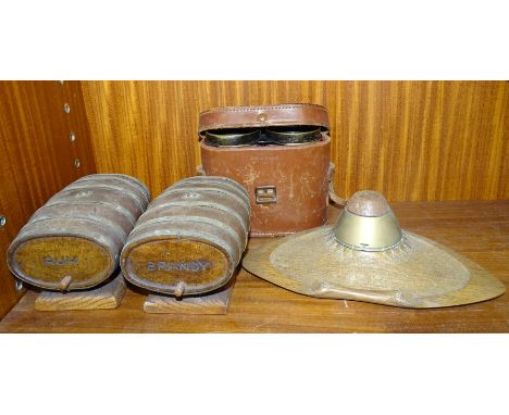 A trenchwork inkwell&nbsp;made from the top of a brass shell on oak base, carved&nbsp;1918, 23cm wide, a pair of wooden metal