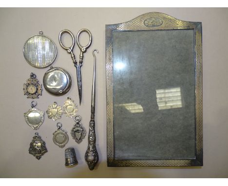 A rectangular engine-turned silver photo frame, 21 x 13cm, Birmingham 1929, together with seven silver medallions and other s