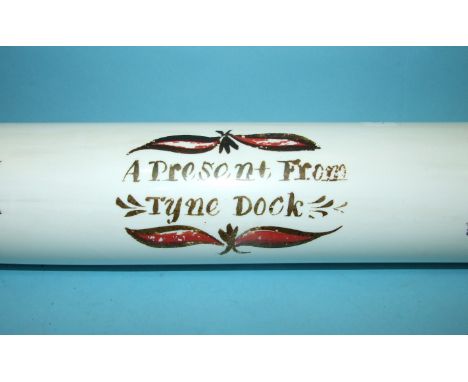 A large opaque glass rolling pin "A Present from Tyne Dock", painted with maritime rhymes and images, 81cm long. 