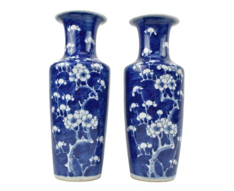 A pair of Qing dynasty blue and white ceramic vases. Each baluster shaped vase decorated with prunus pattern. Double blue rin