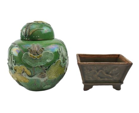 A 20th century ceramic ginger jar and a moulded green glazed planter. The lot to include a green ground ovoid shaped ginger j