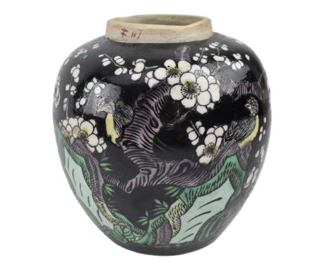 A Qing dynasty famille noire ceramic ginger jar. The ovoid shaped jar decorated with famille verte against black background w